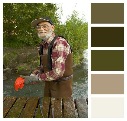 Fisherman Cleans Fish Image