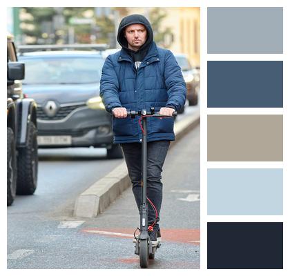 Man Riding Park Street Image