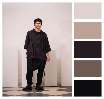 Minimalist Fashion Contemporary Elegance Bold Statement Dynamic Pose Image